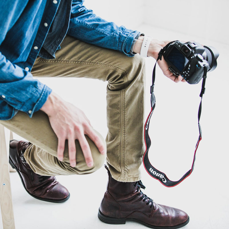 photo of man holding camera